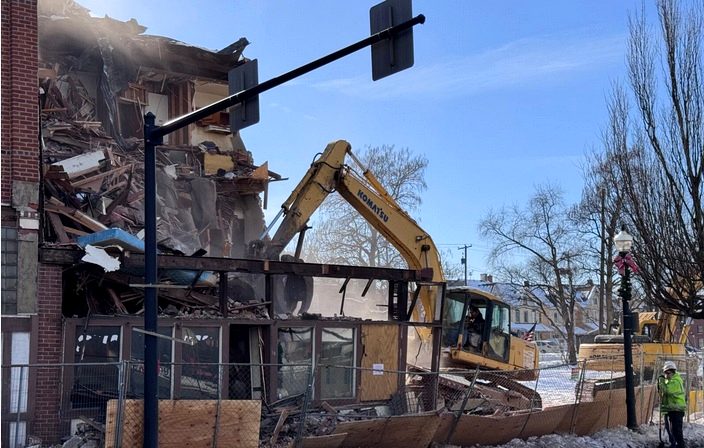 Excavator working through a building demolition