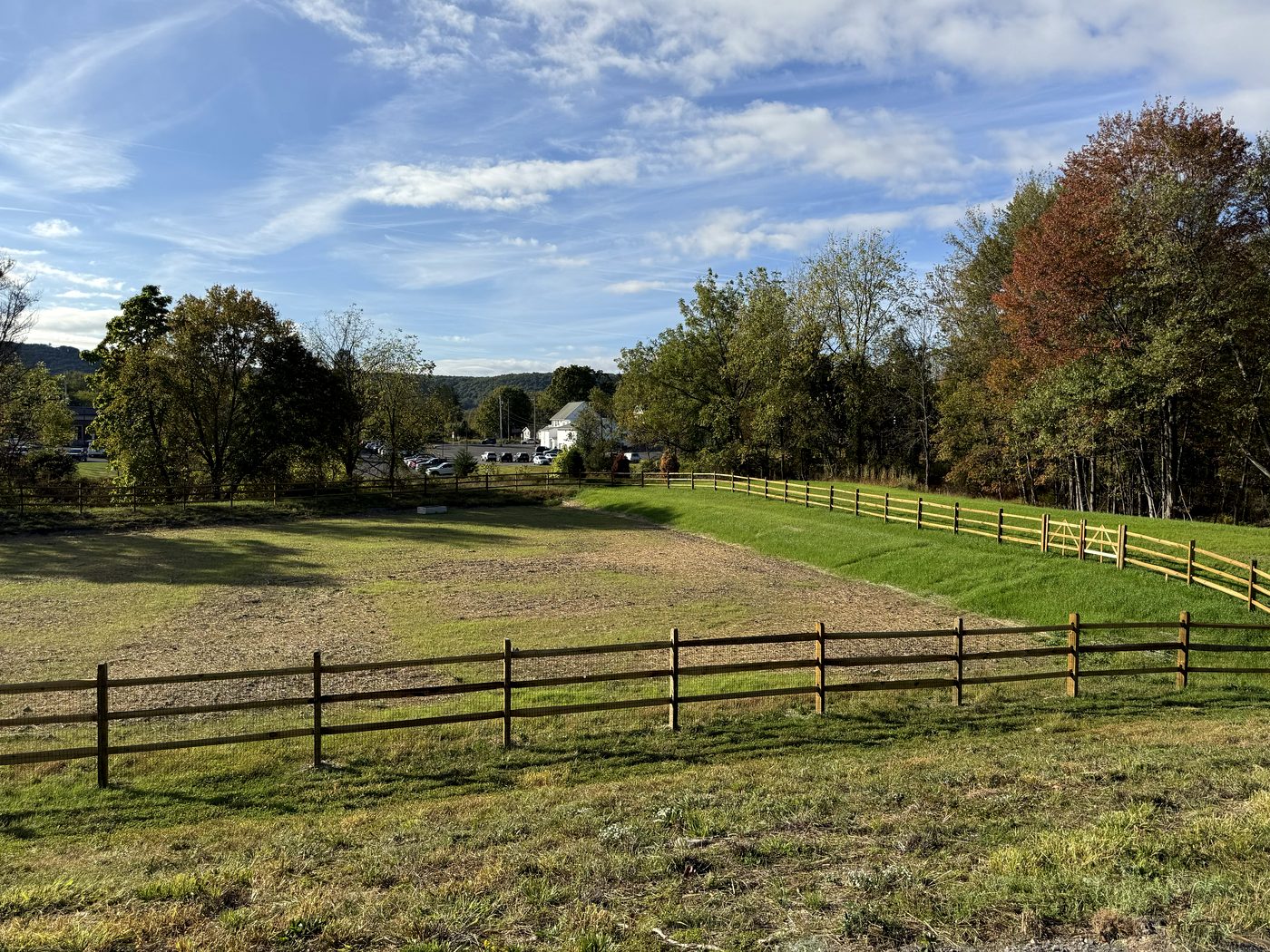 Wide field brought to even grade along a wooden fence line